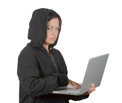 Criminal Woman Hacker Wearing Hood On Using a Laptop