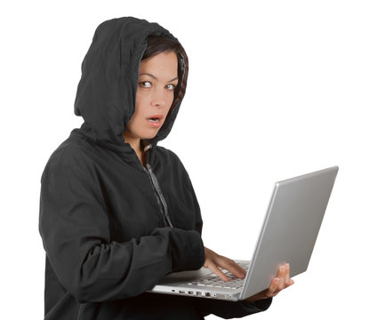 Criminal Woman Hacker Wearing Hood On Using a Laptop
