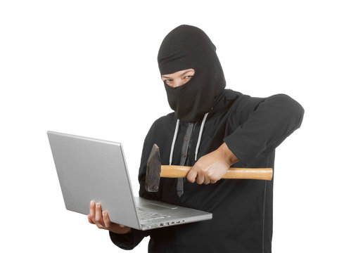 Criminal Woman Hacker Wearing Hood On in Black Clothes and Balaclava Destroy  Laptop with Hammer