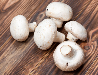 Champignon Mushrooms on Vintage Rustic Wooden Table Background