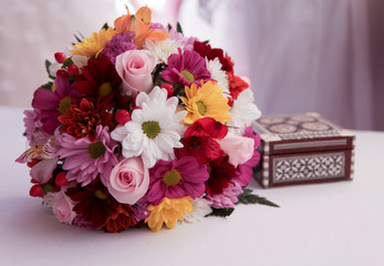 a wedding flower bouquet and arabian little box