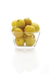 Yellow plums (Prunus domestica) in a small glass bowl