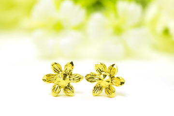 Gold pendant cameo earring jewelry with flowers isolated on white