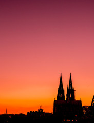 Fototapeta premium Evening skyline silhouette of Cologne, Germany with copy scape