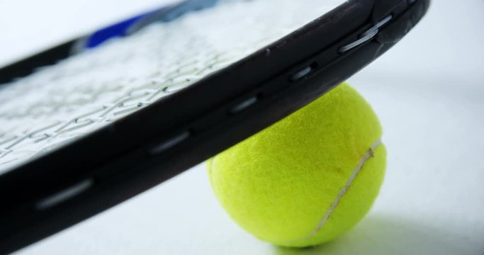 Racket on tennis ball 