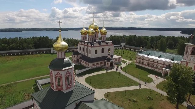 Valday Iversky Russian Orthodox Monastery inside. Valdaysky National Park UNESCO unique historical Biosphere Reserve Lake Seliger. Flight drift aerial drone. Beautiful nature summer clouds horizon.