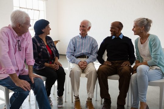 Friends Talking During Discussion In Art Class