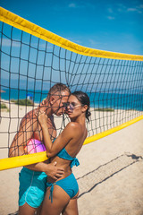 Heterosexual Couple kissing on the beach. Couple in love. Fashion photo. Adult. Having sex. Model. Passionate concept. Hot girl. Sea beach. Erotic. Beauty. Sensuality. Lifestyle. Dreaming. Life.