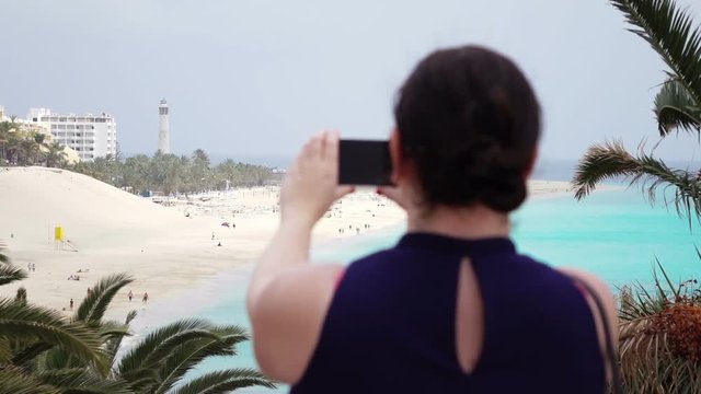High quality video of woman taking a picture by mobile phone in real 1080p slow motion 120fps