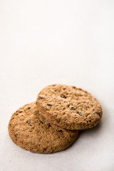 Brown chocolate biscuits isolated on the white marble background