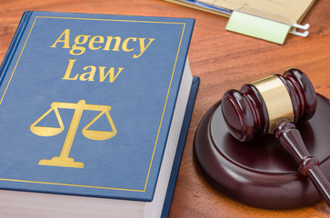 A law book with a gavel - Agency law