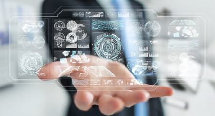 Businessman using digital screens with holograms datas 3D rendering