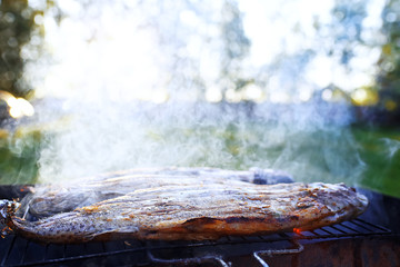 Fish on the grill in the street