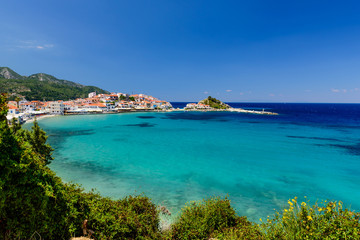 Fototapeta na wymiar Picturesque Bay with blue water in Kokkari village, Samos island, Greece