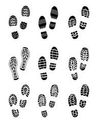 Black prints of shoes on a white background