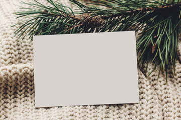 christmas empty card. blank christmas note or wish list on stylish simple knitted sweater with fir for christmas holidays. eco design. xmas  seasonal greetings mock up. letter to santa claus