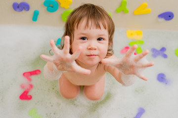 Child in a bath with foam