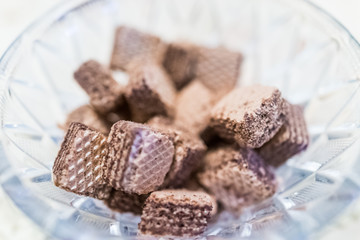 Chocolate wafer squares in crystal bowl macro closeup