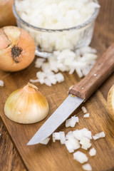 Fototapeta na wymiar Fresh made Chopped white onions on a rustic background