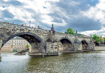 Landscape of the romantic city of Prague under a blue sky. Panoramic view of Charles bridge and old town on a summer day in the capital Czech Republic. Cruise on the Moldovan river. 