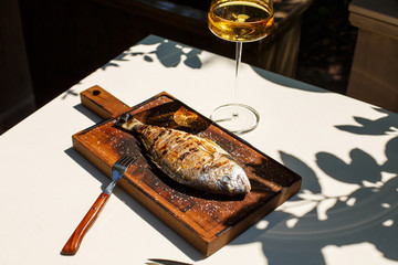 fish grilled. dish. wine