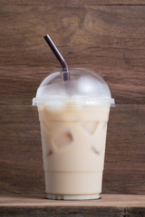 ice soft drink on old wooden shelf made by espresso, syrup and milk