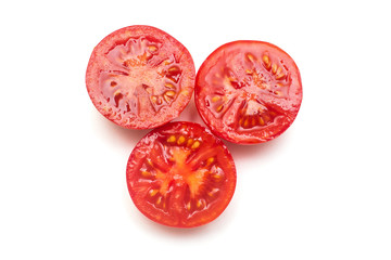 Red tomatoes whole and pieces isolated on white background. Vegetables. Organic food. Tasty and...