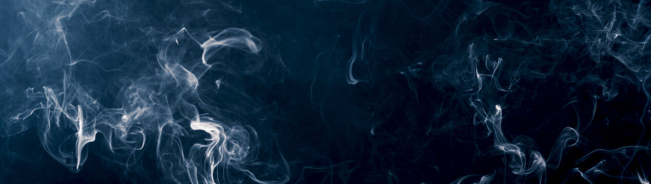 panorama of moving white smoke in blue light mood against dark background