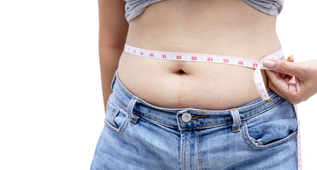 Woman measuring her waistline fat tummy isolated on white background with clipping path. ,obese...