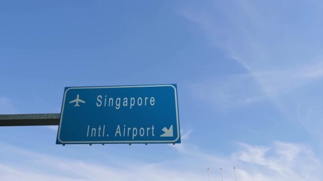Singapore airport sign airplane passing overhead