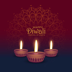 beautiful diwali greeting card design with three diya lamps