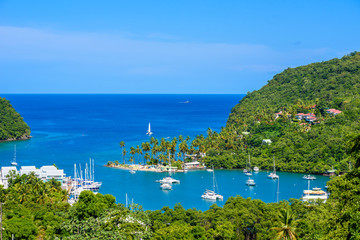 Marigot Bay, Saint Lucia, Caribbean. Tropical bay and beach in exotic and paradise landscape scenery. Marigot Bay is located on the west coast of the Caribbean island of St Lucia.