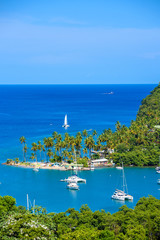 Marigot Bay, Saint Lucia, Caribbean. Tropical bay and beach in exotic and paradise landscape scenery. Marigot Bay is located on the west coast of the Caribbean island of St Lucia.