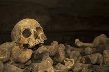 Medieval skull and bones in the catacombs of Paris.
