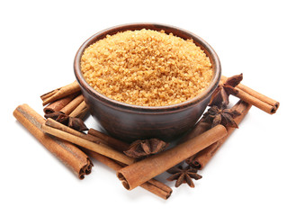 Composition with cinnamon sugar and sticks on white background