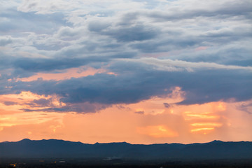 colorful dramatic sky with cloud at sunset.