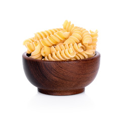 Pasta on wooden bowl  isolated on white background