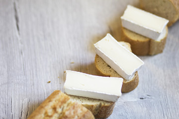 A few pieces of sliced baguette with brie cheese