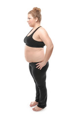 Overweight young woman on white background. Weight loss concept