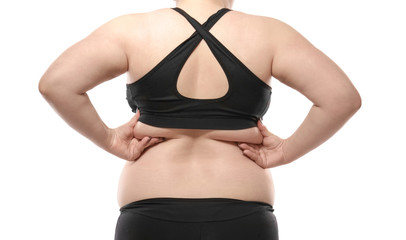 Woman touching fat on her back against white background. Weight loss concept
