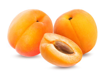 Fresh three apricots with leafs isolated on white background