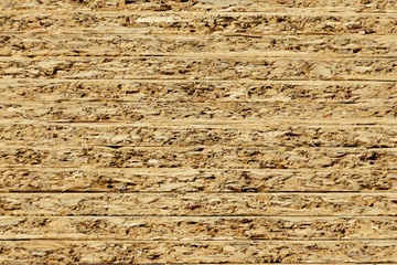 Fototapeta premium Profile of the flake board a stacked. Wooden sawdust background.