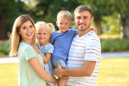 Happy family in park on sunny day