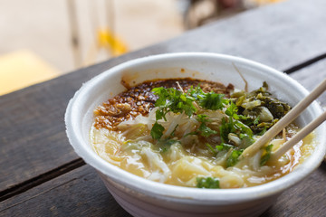 Hot Kao feun. It made from pea flour and water and add sauce, chili in oil, vegtable peanut and seasame