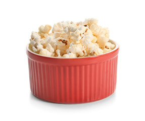 Bowl with popcorn on white background