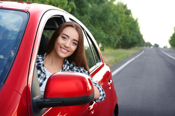 Young woman driving car