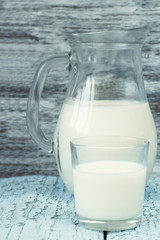 Jar with milk, and full glass with milk