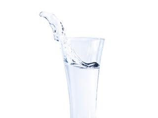 Fototapeta na wymiar Drinking water with splash isolated with clipping path