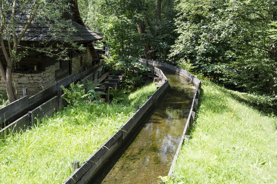 The wooden water canal at the mill.