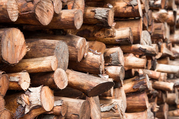 Natural wooden background - closeup of chopped firewood.